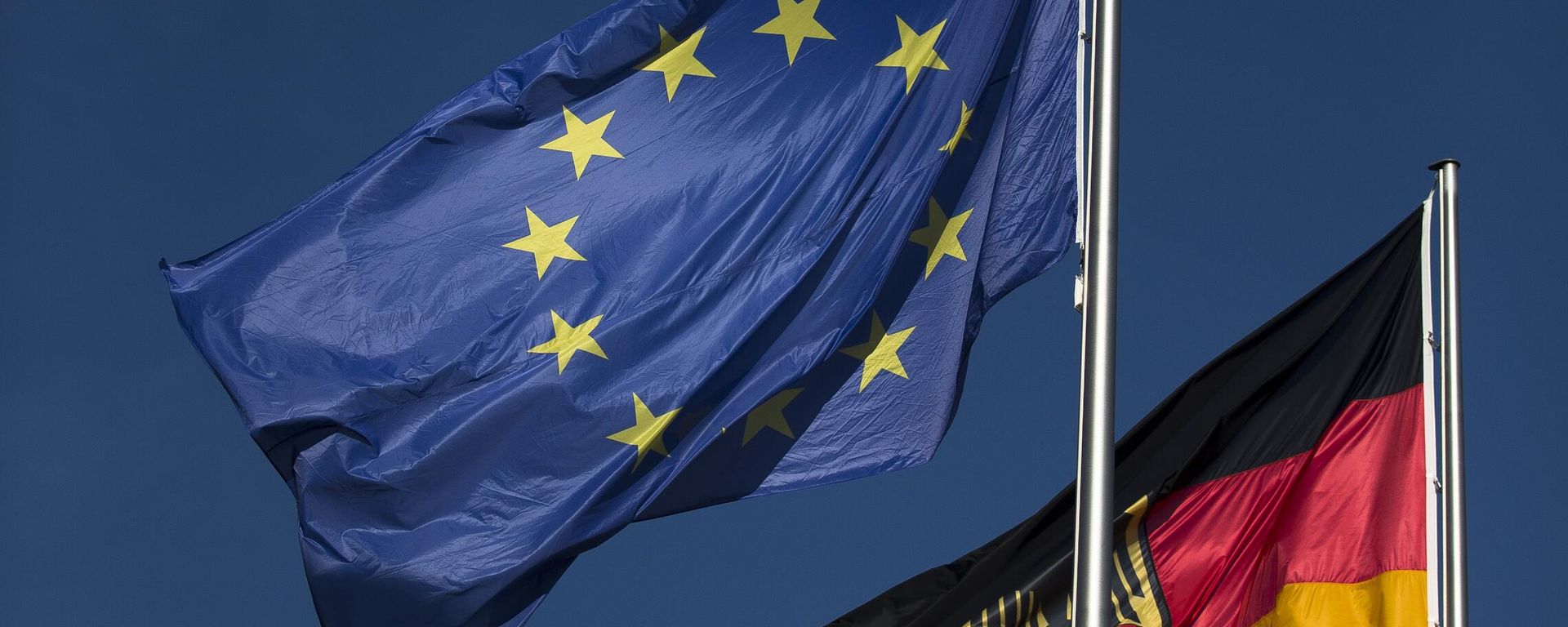 An European flag and a German flag wave in the wind in front of the chancellery Friday, Oct. 12, 2012 in Berlin. An European flag and a German flag wave in the wind in front of the chancellery Friday, Oct. 12, 2012 in Berlin. - Sputnik International, 1920, 23.01.2024