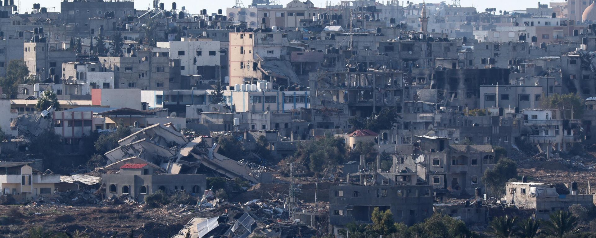 A picture taken on January 25, 2024 from southern Israel on the border with the Gaza Strip shows buildings in the Palestinian territory destroyed during Israeli bombardment, amid the ongoing battles between Israel and the militant group Hamas - Sputnik International, 1920, 03.02.2024