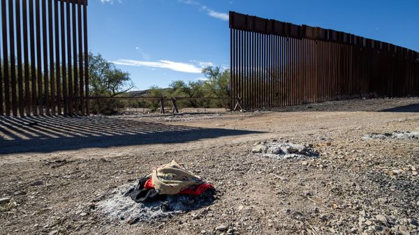 Ashes from bonfires are pictured next to the US-Mexico border wall in Sasabe, Arizona, on December 5, 2023. Jaguars don't understand borders, but where the United States meets Mexico, they are having to adapt to them - Sputnik International