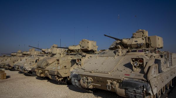 Bradley fighting vehicles are parked at a US military base at an undisclosed location in Northeastern Syria - Sputnik International