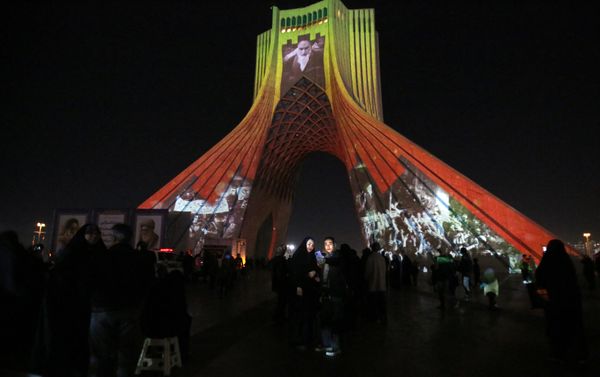 Pictured: The famous Azadi (Freedom) Tower is illuminated with historical photographs of the late Iranian Supreme Leader Ayatollah Ruhollah Khomeini, leader of the Islamic Revolution, and Iran's national flag during a ceremony of the 45th anniversary of the Islamic Revolution, in Tehran, February 10, 2024.After February 1979, it took Moscow and Tehran time to calibrate their new relationship. Then-Soviet leader Leonid Brezhnev hailed the revolution as a "great historical victory for the Iranian people," with the USSR becoming the first country in the world to recognize the new government. Moscow was undoubtedly relieved by the ouster of an American puppet regime in such a strategically vital country bordering its soft southern underbelly, and heartened by Tehran's decision to break off relations with Washington and join the Non-Aligned Movement. - Sputnik International