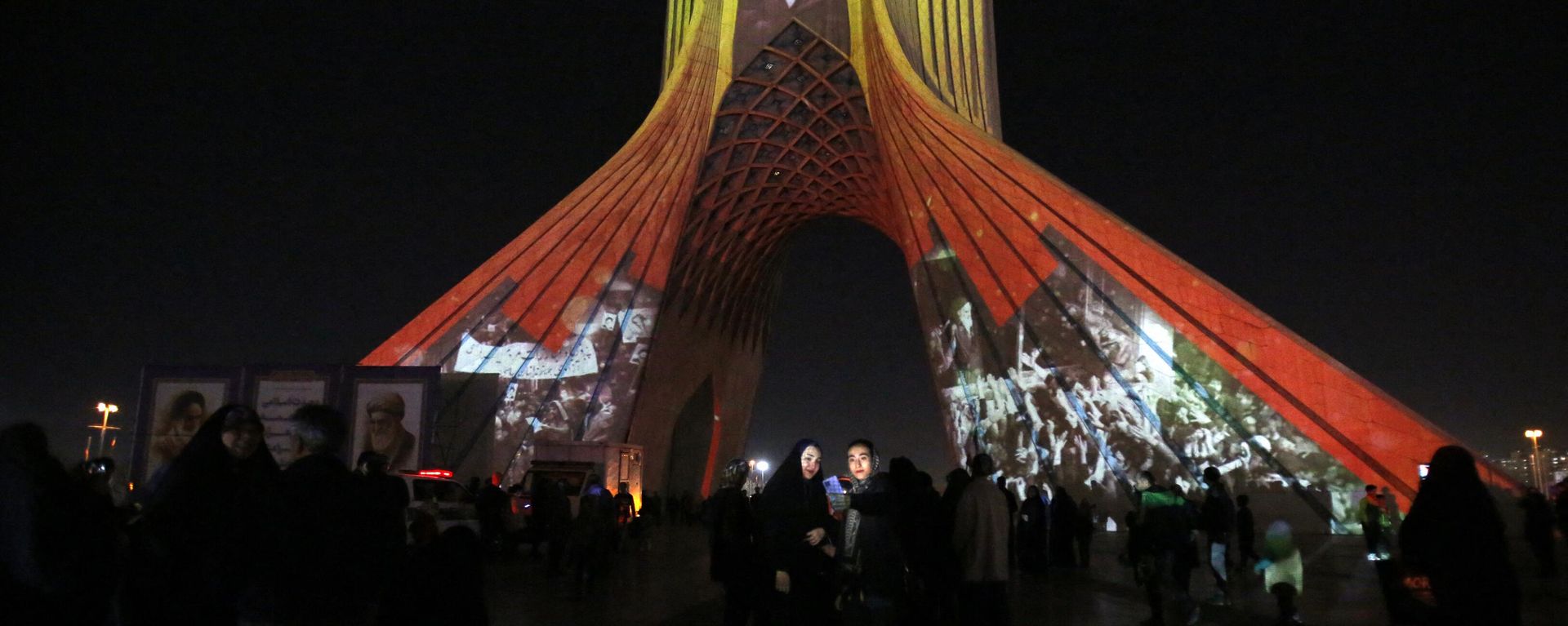 The famous Azadi (Freedom) Tower is illuminated with historical photographs of the late Iranian Supreme Leader Ayatollah Ruhollah Khomeini, leader of the Islamic Revolution, and Iran's national flag during a ceremony of the 45th anniversary of the Islamic Revolution, in Tehran, February 10, 2024. The famous Azadi (Freedom) Tower is illuminated with historical photographs of the late Iranian Supreme Leader Ayatollah Ruhollah Khomeini, leader of the Islamic Revolution, and Iran's national flag during a ceremony of the 45th anniversary of the Islamic Revolution, in Tehran, February 10, 2024. - Sputnik International, 1920, 11.02.2024