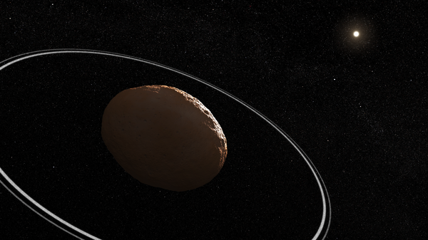 An illustration showing what Centaur 10199 Chariklo and its rings could look like.  - Sputnik International