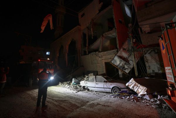 Rescue workers inspect the scene following Israeli strikes on Rafah.  - Sputnik International