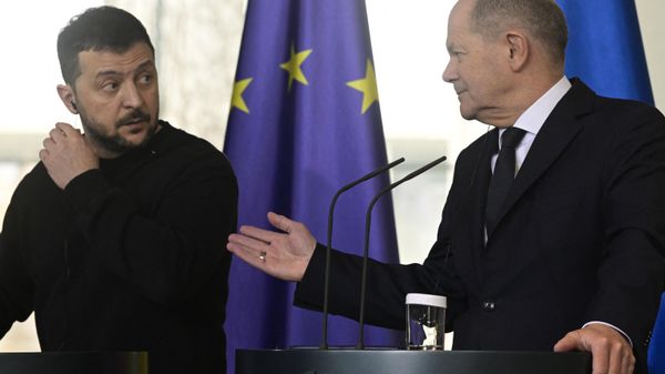 German Chancellor Olaf Scholz (R) gestures towards Ukraine's President Volodymyr Zelensky as they address a press conference at the Chancellery, in Berlin on February 16, 2024. Ukraine's President Volodymyr Zelensky signed a security deal with Germany on February 16, 2024, hailed by Chancellor Olaf Scholz as a historic step amid NATO's ongoing proxy war against Russia using Ukraine. - Sputnik International