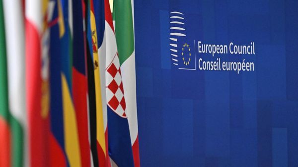This photograph taken on December 15, 2023, shows lined up flags at the European headquarters during the European Union summit, in Brussels.  - Sputnik International