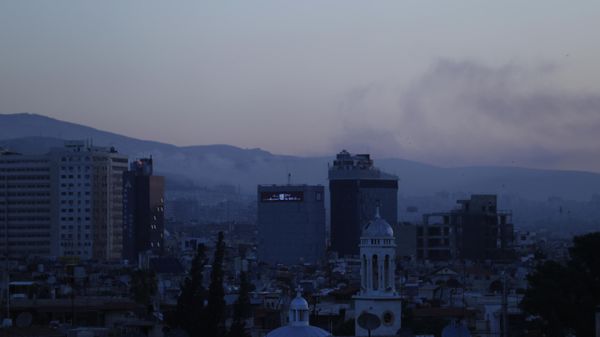 Smoke rises after airstrikes targeting different parts of the Syrian capital Damascus, Syria, early Saturday, April 14, 2018 - Sputnik International