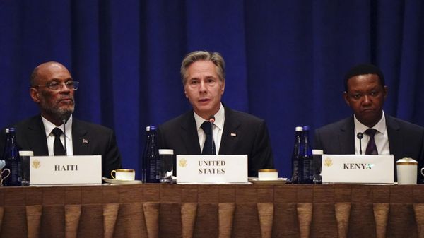 United States Secretary of State Antony Blinken, center, sits  by Prime Minister of Haiti Ariel Henry, left, and Kenyan Cabinet Secretary for Foreign and Diaspora Affairs Alfred Nganga Mutua, right, addresses diplomats and media during a meeting on the security situation in Haiti in New York on Friday, Sept. 22, 2023.  - Sputnik International