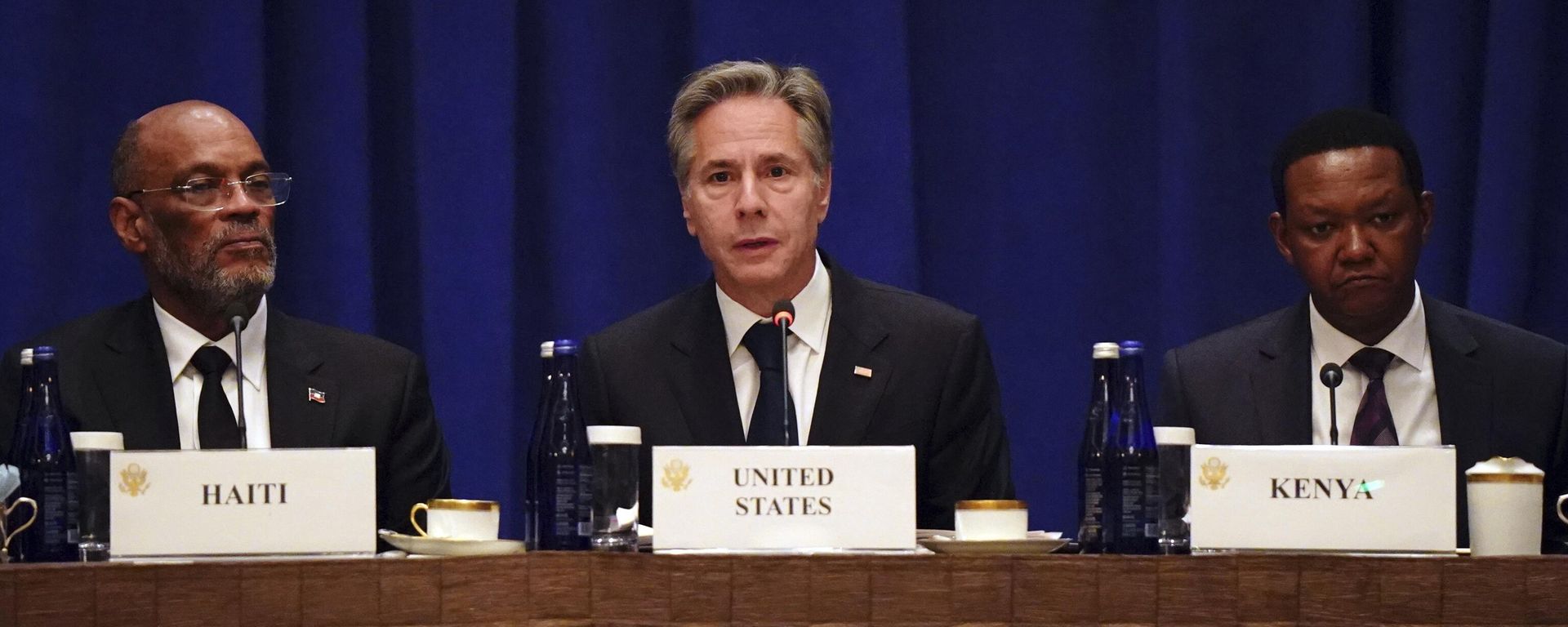 United States Secretary of State Antony Blinken, center, sits  by Prime Minister of Haiti Ariel Henry, left, and Kenyan Cabinet Secretary for Foreign and Diaspora Affairs Alfred Nganga Mutua, right, addresses diplomats and media during a meeting on the security situation in Haiti in New York on Friday, Sept. 22, 2023.  - Sputnik International, 1920, 10.03.2024
