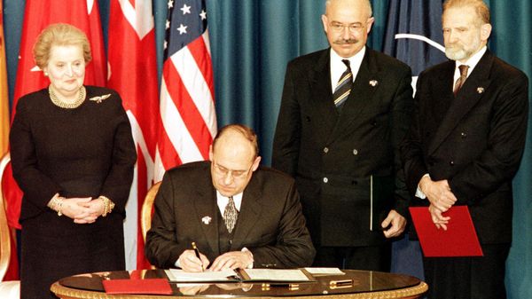 The Minister of Foreign Affairs of the Czech Republic Jan Kavan (seated) signs the accession document that enters the Czech Republic into NATO 12 March 1999 at the Harry Truman library in Independence, MO. Standing are US Secretary of State Madeleine Albright (L), Minister of Foreign Affairs of Hungary Janos Martonyi (C), and Minister of Foreign Affairs of Poland Bronislaw Geremek (R). The Minister of Foreign Affairs of the Czech Republic Jan Kavan (seated) signs the accession document that enters the Czech Republic into NATO 12 March 1999 at the Harry Truman library in Independence, MO. Standing are US Secretary of State Madeleine Albright (L), Minister of Foreign Affairs of Hungary Janos Martonyi (C), and Minister of Foreign Affairs of Poland Bronislaw Geremek (R). - Sputnik International