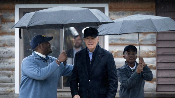 US President Joe Biden is greeted by Hurley Coleman III (L) and Hurley Coleman IV (R) while arriving for a campaign event with supporters at Pleasant View Golf Course in Saginaw, Michigan, on March 14, 2024. - Sputnik International