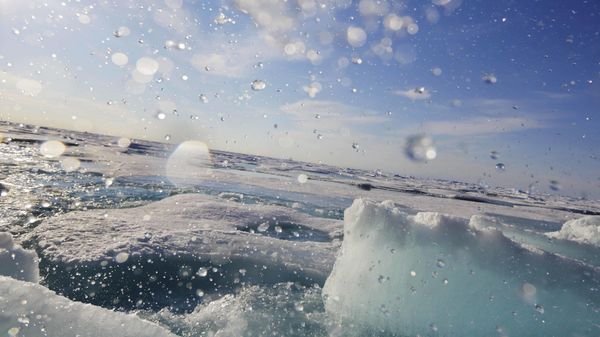 Water sprays as a block of sea ice is broken from the hull of the Finnish icebreaker MSV Nordica as it sails the Victoria Strait while traversing the Arctic's Northwest Passage, Friday, July 21, 2017 - Sputnik International