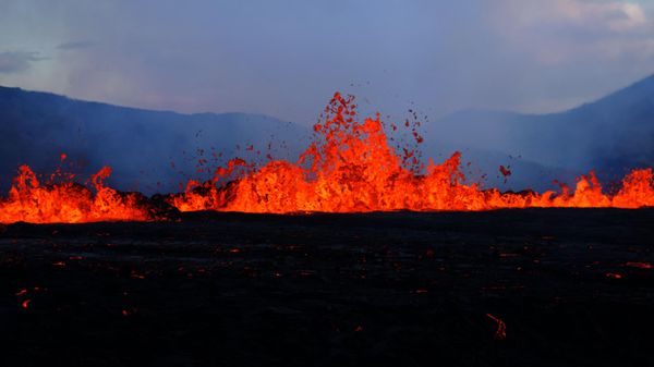 Lava erupts and flows at the scene of the newly erupted volcano at Grindavik, Iceland on August 3, 2022. A volcano erupted on August 3, 2022 in Iceland in a fissure near Reykjavik, the Icelandic Meteorological Office (IMO) said as lava could be seen spewing out of the ground in live images on local media - Sputnik International