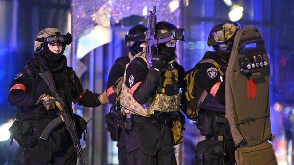 Police officers near the Crocus City Hall concert venue in Moscow after it was targeted by a terrorist attack. - Sputnik International