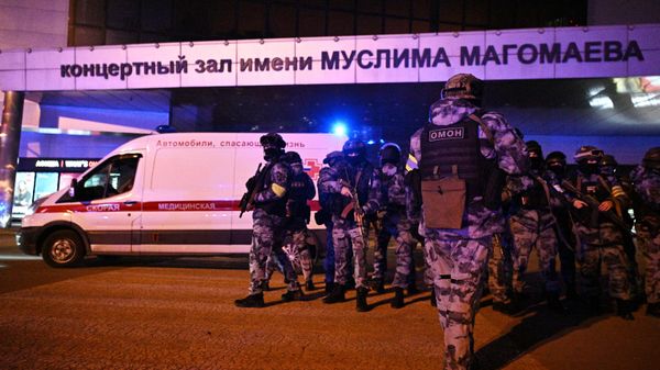 Russian security services deployed around the Crocus City Hall concert venue following Friday's deadly terrorist incident. - Sputnik International