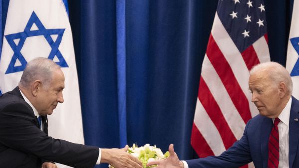 US President Joe Biden shakes hands with Israeli Prime Minister Benjamin Netanyahu as they meet on the sidelines of the 78th United Nations General Assembly in New York City on September 20, 2023.  - Sputnik International