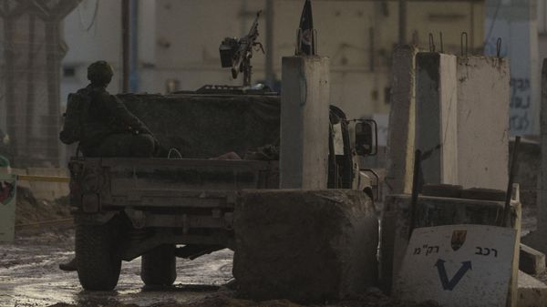 A person is seen detained on the back of an Israeli army vehicle in Erez crossing at the Israeli-Gaza border, southern Israel, Tuesday, Jan. 2, 2024. (AP Photo/Leo Correa) - Sputnik International