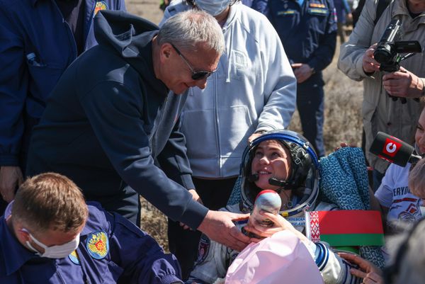 Yury Borisov, Director General of the Federal Space Agency Roscosmos, presents Marina Vasilevskaya with a traditional Russian matryoshka doll with Marina's face painted on it.  - Sputnik International