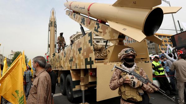 Iranian soldiers stand next to a Kheibar missile (R) and a Shahab-3 missile (L) during a rally marking al-Quds (Jerusalem) day, in street at the capital Tehran, on April 29, 2022.  - Sputnik International