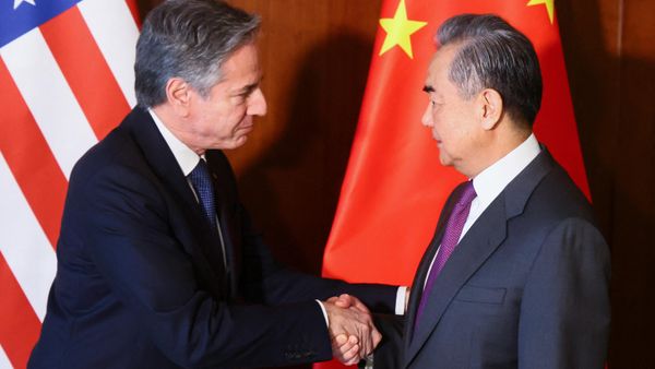 US Secretary of State Antony Blinken (L) and Chinese Foreign Minister Wang Yi shake hands as they meet at the 60th Munich Security Conference (MSC) at the Bayerischer Hof Hotel in Munich, southern Germany on February 16, 2024. - Sputnik International