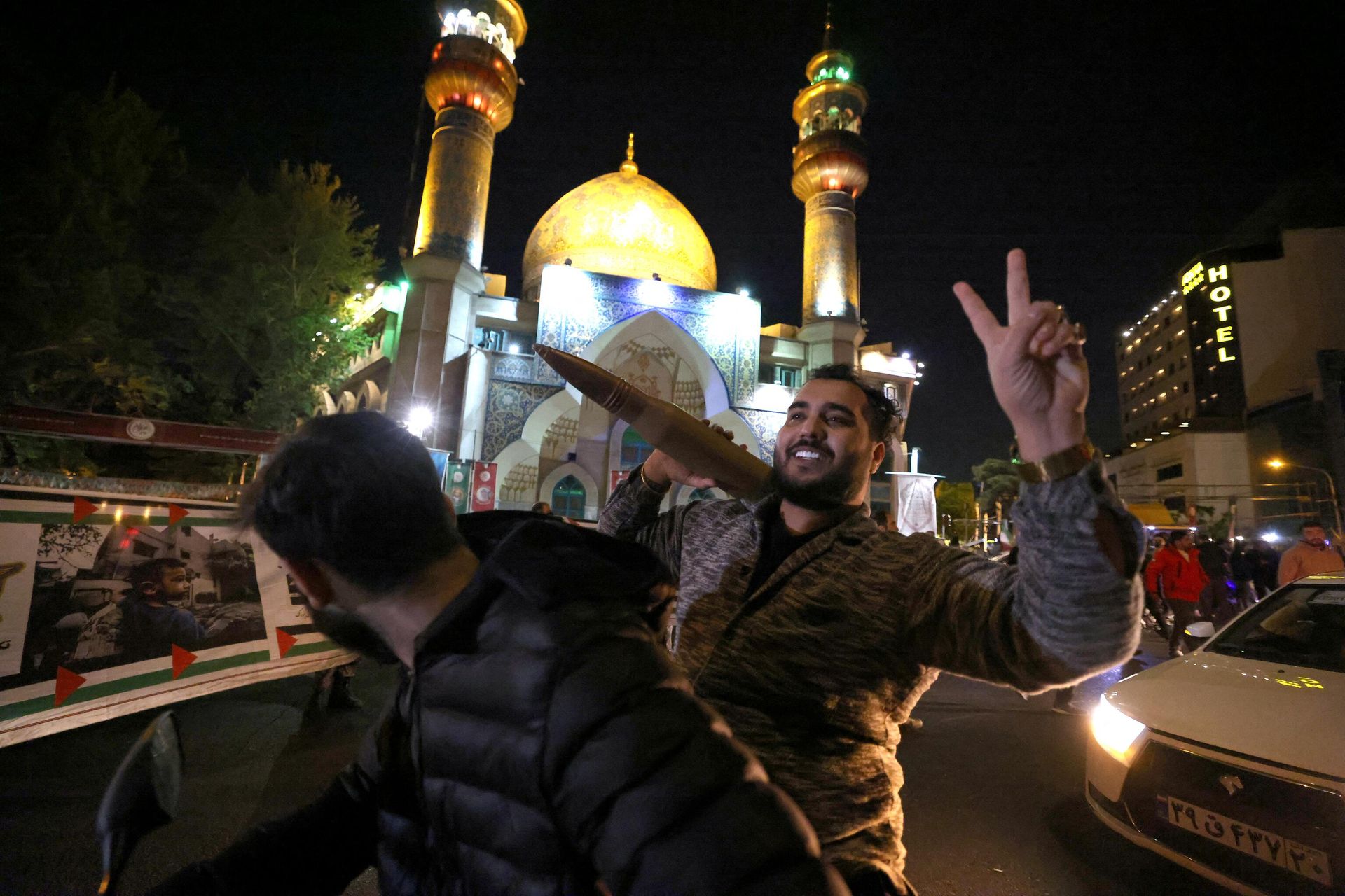 A demonstrator holds a bullter shell replica as others gather at Palestine Square in Tehran on April 14, 2024, after Iran launched a drone and missile attack on Israel. - Sputnik International, 1920, 14.04.2024