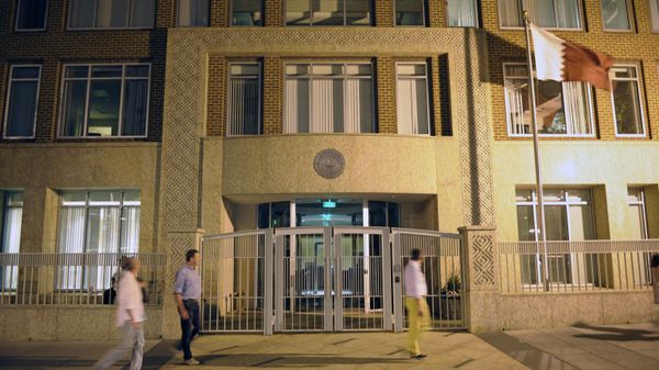 Pedestrians walk-by the Embassy of Qatar in Washington, Wednesday, April 7, 2010. A Qatari diplomat trying to sneak a smoke in an airplane bathroom on a flight from Washington to Denver, sparked a bomb scare, with fighter jets scrambled and law enforcement put on high alert, law enforcement officials said - Sputnik International