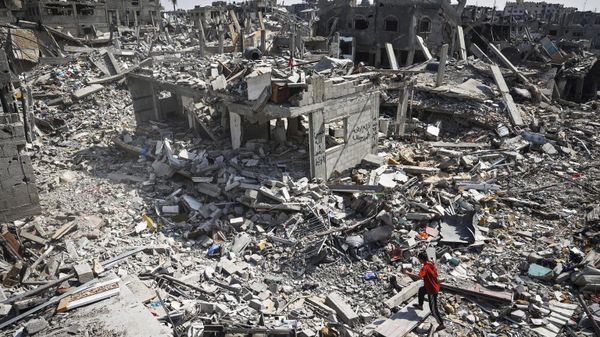 A youth walks over the rubble of buildings destroyed during Israeli bombardment in Khan Yunis, on the southern Gaza Strip on April 16, 2024. - Sputnik International