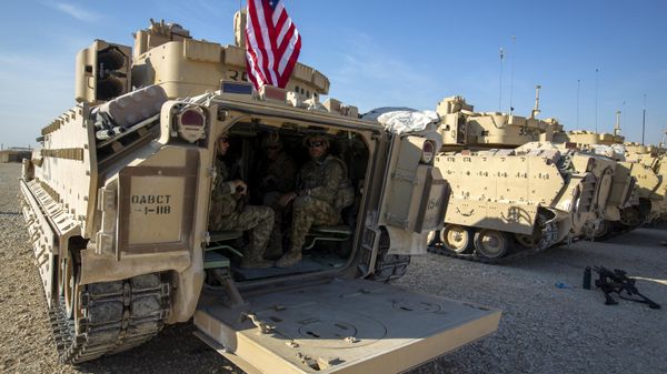 Crewmen sit inside Bradley fighting vehicles at a US military base at an undisclosed location in Northeastern Syria, Monday, Nov. 11, 2019. - Sputnik International