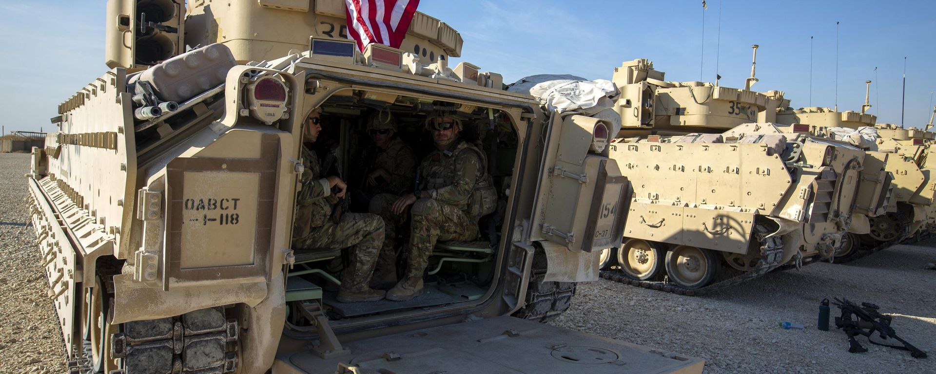 Crewmen sit inside Bradley fighting vehicles at a US military base at an undisclosed location in Northeastern Syria, Monday, Nov. 11, 2019. - Sputnik International, 1920, 04.03.2026