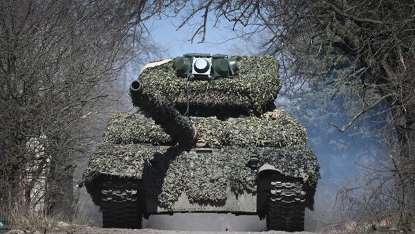 Russia's T-72 tank equipped with anti-drone protection is seen in the special military operation zone. File photo - Sputnik International