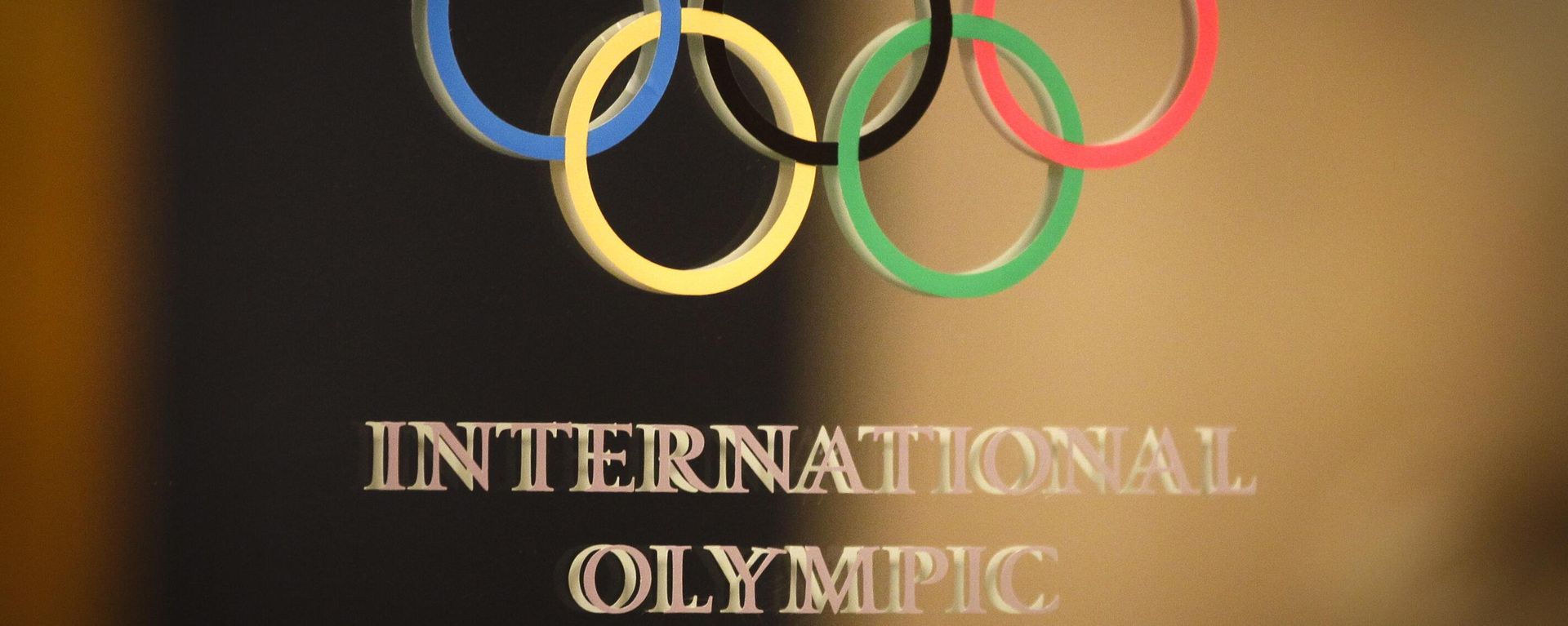 The International Olympic Committee (IOC) logo is seen on the door at a meeting of the IOC Executive Board at a hotel in London, prior to the 2012 Summer Olympics, Saturday, July 21, 2012 - Sputnik International, 1920, 07.07.2026