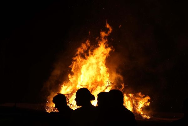 Young men stand in front of a bonfire during Christian Orthodox Easter celebrations in Xylophagou village, southeast of the island of Cyprus.  - Sputnik International