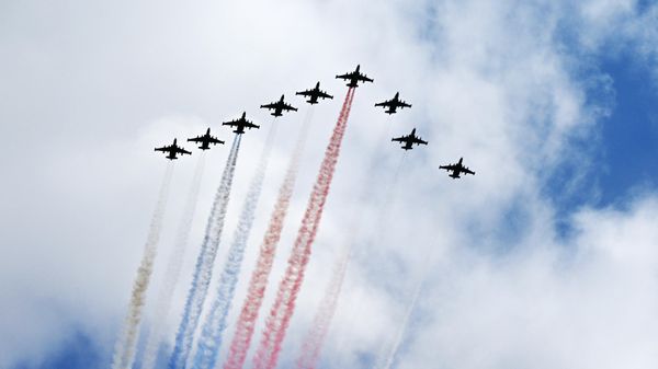 Russian Su-25 jet aircrafts release smoke in the colours of the Russian national flag during a military parade on Victory Day, which marks the 79th anniversary of the victory over Nazi Germany in World War Two, in Red Square in Moscow, Russia - Sputnik International