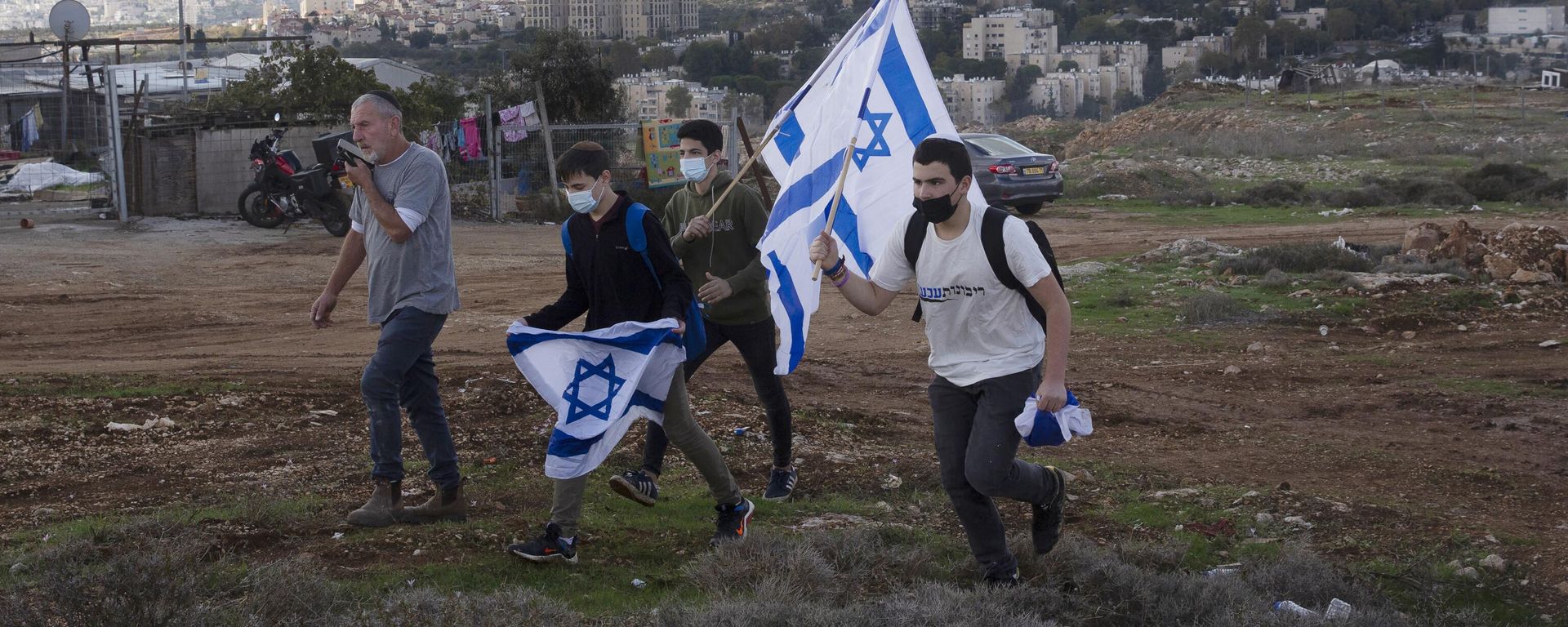 In this Nov. 16, 2020, file, photo, protesters arrive to heckle a news conference by European Union officials visiting the construction site for Givat Hamatos settlement in Jerusalem. Israel is quietly advancing controversial settlement projects in and around Jerusalem while refraining from major announcements that could anger the Biden administration. Critics say Israel is paving the way for rapid growth when the political climate changes - Sputnik International, 1920, 16.05.2024