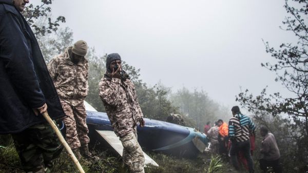 Rescue team members work at the crash site of a helicopter carrying Iranian President Ebrahim Raisi in Varzaghan, in northwestern Iran, on May 20, 2024.  - Sputnik International