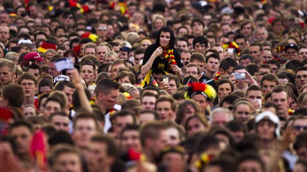 German soccer fans reacts as they watch the Euro 2012 quarter final soccer match between Germany and Greece at Germany's largest public viewing zone named fan mile in Berlin, Friday, June 22, 2012 - Sputnik International