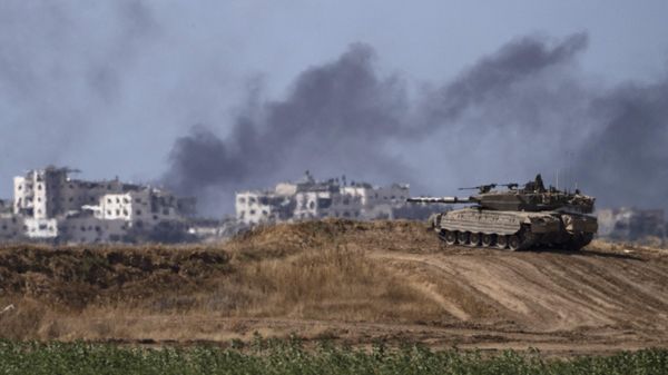 Backdropped by smoke rising to the sky after an explosion in the Gaza Strip, an Israeli tank stands near the Israel-Gaza border as seen from southern Israel, Monday, May 13, 2024 Backdropped by smoke rising to the sky after an explosion in the Gaza Strip, an Israeli tank stands near the Israel-Gaza border as seen from southern Israel, Monday, May 13, 2024 - Sputnik International