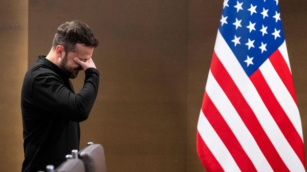Ukraine's Volodymyr Zelensky stands next to a US flag on the sidelines of the Summit on peace in Ukraine on June 15, 2024 in Switzerland. - Sputnik International