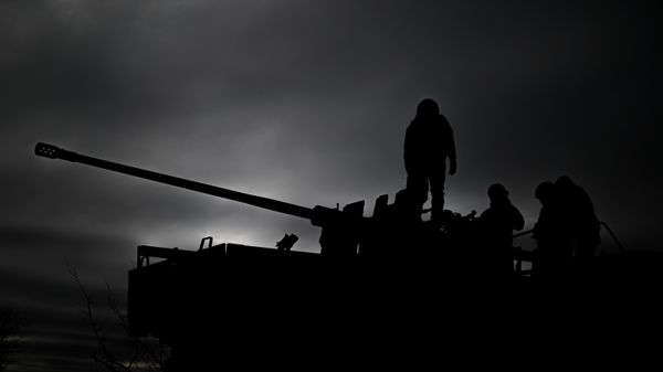 Russian servicemen of an artillery unit ride a Kamaz vehicle with a mounted AZP S-60 anti-aircraft gun  - Sputnik International