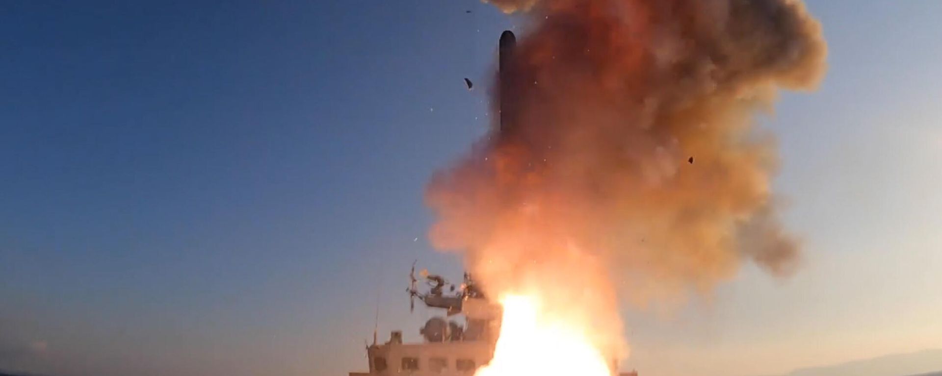 In this handout video grab released by the Russian Defense Ministry, a Russian naval  ship launches missiles during a high-precision attack on Ukrainian military facilities during Russia's military operation in Ukraine, at an unknown location.  - Sputnik International, 1920, 26.06.2024