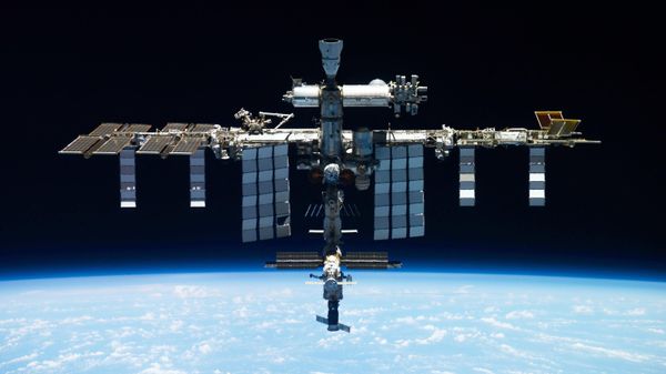 This undated photo provided by Roscosmos shows the International Space Station. On Monday, Oct. 9, 2023, the Russian space agency said there was a leak in a backup coolant line for a new science lab at the station, but the crew and station aren't in danger - Sputnik International