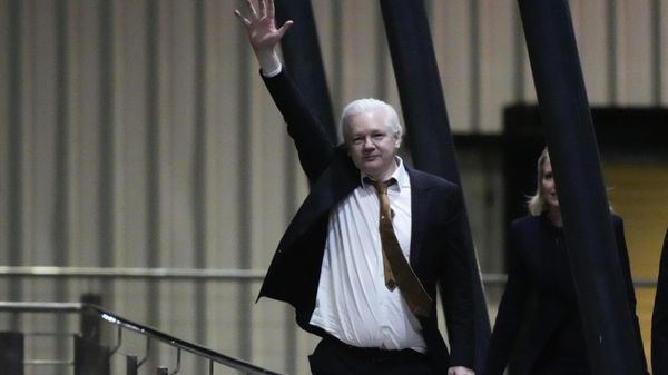 WikiLeaks founder Julian Assange waves after landing at RAAF air base Fairbairn in Canberra, Australia, Wednesday, June 26 2024. Assange has returned to his homeland Australia aboard a charter jet hours after pleading guilty to obtaining and publishing U.S. military secrets in a deal with Justice Department prosecutors that concludes a drawn-out legal saga. - Sputnik International
