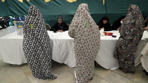 Women get their ballot paper during the Iranian presidential election in a polling station at the shrine of Saint Saleh in northern Tehran, Iran, Friday, June 28, 2024.  - Sputnik International