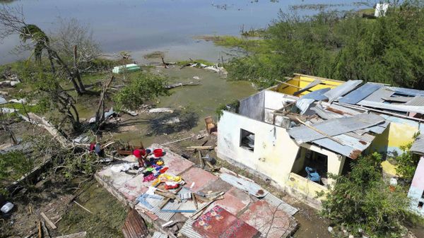 A woman retrieves belongings from her home that was hit by Hurricane Beryl in Portland Cottage, Clarendon, Jamaica, Thursday, July 4, 2024. - Sputnik International