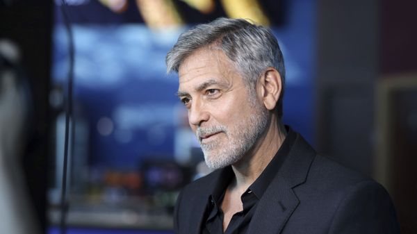 Actor George Clooney talks to reporters on arrival at the premiere of the television mini-series 'Catch22', in London - Sputnik International