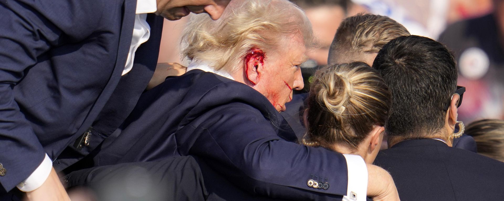 Republican presidential candidate former President Donald Trump is helped off the stage at a campaign event in Butler, Pa., on Saturday, July 13, 2024.  - Sputnik International, 1920, 14.07.2024