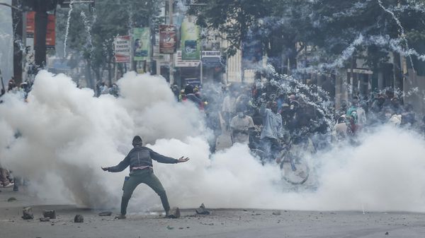 A teargas canister detonates as a protester gestures at Kenyan anti-riot police officers during anti-government protests in Nairobi on July 16, 2024. Police were out in force in the centre of Kenya's capital on Tuesday after calls for more demonstrations against the embattled government of President William Ruto. - Sputnik International