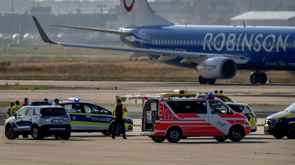 Emergency vehicles and police cars are parked on a runway at the airport in Frankfurt, Germany, as climate activists were gluing themselves to the ground blocking air traffic for several hours - Sputnik International