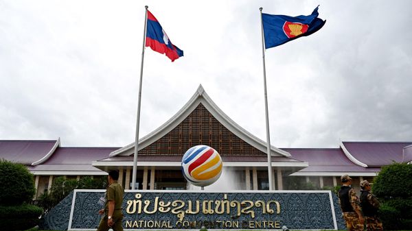 Security personnel walk in front of the National Convention Centre, venue for the Association of Southeast Asian Nations (ASEAN) Foreign Ministers' Meeting and related meetings, in Vientiane on July 24, 2024. - Sputnik International