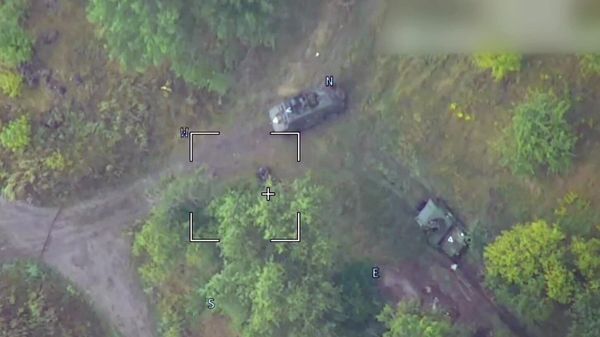 In this handout video grab released by the Russian Defence Ministry, a view shows a strike of a Russian Lancet kamikaze drone on a US-made Bradley infantry fighting vehicle used by Ukrainian troops in the border area of the Russia's Kursk Region.  - Sputnik International